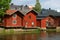 Three old red barns on the bank of the Porvonjoki river, Porvoo. Finland