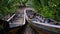 Three old traditional fishing boats, which have been damaged by the river and nipa forest