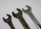 Three old working wrenches on a white background. Work Tool mechanic. Close up