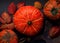 Three orange Pumpkins on Food Background black, Thanksgiving autumn bright colors still life Flatlay