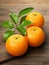 Three oranges on cutting board with leaves, digital painting, oranges, peeled oranges