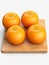 Three oranges on cutting board with leaves, digital painting, oranges, peeled oranges