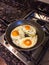 Three Organic Chicken Eggs frying in pan