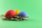 Three painted chicken eggs red blue and yellow