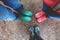 Three pairs of rubber boots at rainy autumn. View above