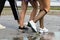 Three pairs of slim fit young girls legs in different sport shoe