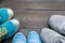 Three pairs of sport sneakers closeup on dark wooden background