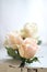 Three pale pink roses