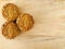 Three Pandan Mooncake on wooden background. Aerial view.