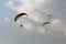 Three paraglider flying on blue sky
