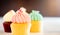 Three Pastel color Cupcake muffins bright lighting