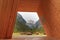 Three peaks view through a giant wooden frame in the Dolomites,