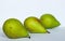 Three pear lie next to, three pears on white background, green pears, three pears