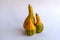 three Pear-shaped bicolor pumpkins on white background