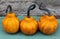 Three pear-shaped pumpkins