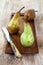 Three pears on wooden tray