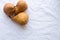 Three peas on white tablecloth