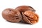 Three pecan nuts on white background