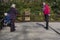 Three People playing Petanque Game.