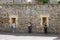 Three people using electronic devices in perfect symmetry.