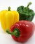 Three peppers green, yellow, red organic