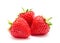 Three perfect red ripe strawberry isolated