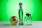 Three perfume bottle on a bright green background