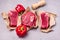 Three Pieces of Raw Fresh Beef Meat Steak on Craft Paper Gray Background Top View Flat Lay Raw Meat Horizontal Pepper Mill and