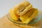 Three pieces of tapai or fermented cassava on a small plate