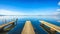 Three piers or jetties, sunset blue panoramic landscape. Orbetello lagoon, Argentario, Italy