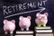 Three piggy banks with retirement savings plan