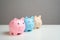 Three piggy banks. Savings and deposit banking. Healthy economy.