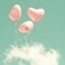 Three Pink Heart-shaped balloons