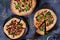 Three pizzas with chanterelle mushrooms and onion
