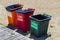 Three plastic trash cans for separate garbage