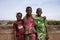 Three Pleasant African Girls Posing For A Panorama Picture On a Bridge
