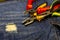 Three pliers pliers with bright handles safety work with electricity home repairman master of furniture appliances