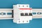 Three-pole miniature circuit breaker on the wall, 3D rendering