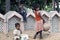 Three poor slum children playing on sand