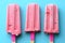 Three Popsicles With Pink Icing on a Blue Background Generative AI