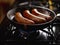 Three pork sausages cooking in a skillet on a gas stove