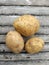 Three Potatoes fruit, full nutritional ingredients, on a bamboo board