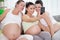 Three pregnant women take photo by mobile phone