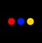 Three primary colours dots on black background
