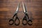 Three professional metal scissors with black handle. Generate Ai