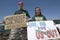 Three protestors in Tucson, AZ of President George W. Bush is holding a sign proclaiming Bush is a Liar and US Out regarding the