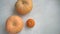 Three pumpkins on a white wooden floor