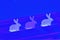 Three purple and white shabby rising Easter bunny on the vivid blue color abstract background