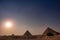 Three Pyramids of Giza Cairo Egypt and Sphinx at sunset