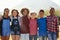 Three quarter length portrait of pre-teen friends in a park